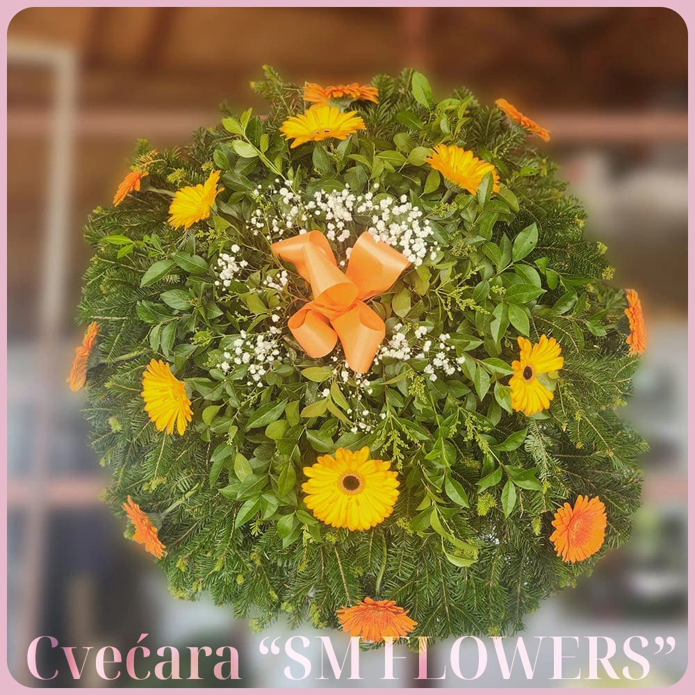 narandzasti gerberi i gipsofila sa narandzastom masnom okrugli venac za groblje